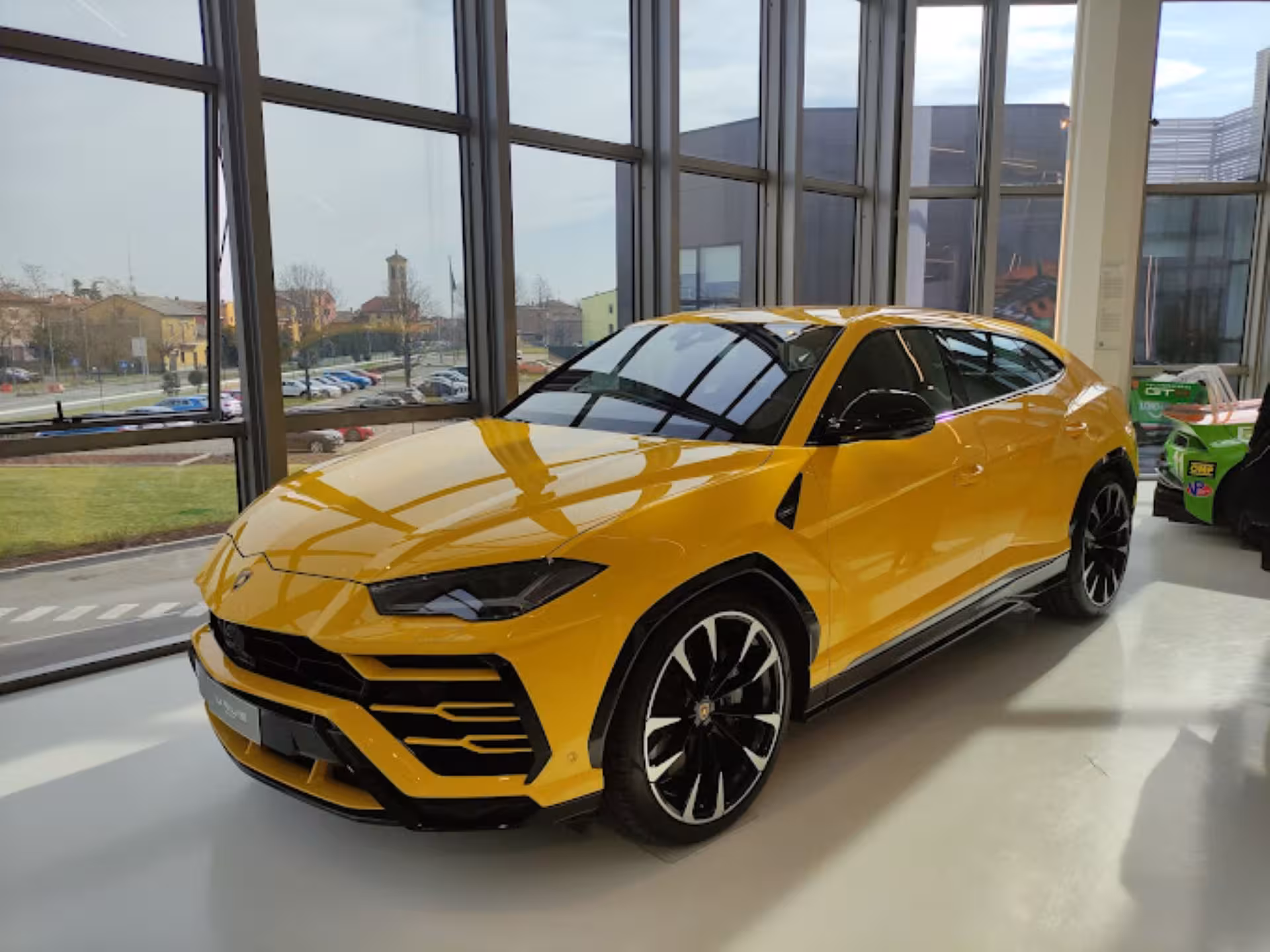 Yellow Lamborghini Urus on display at Automobili Lamborghini Museum near Bologna, Italy supercar tour stop
