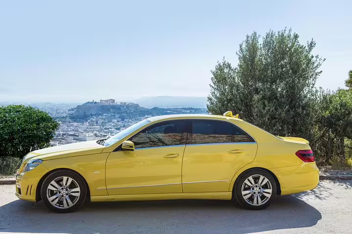 Yellow private sedan for Athens to Ancient Corinth, Epidaurus and Nafplio full-day tour with scenic stop