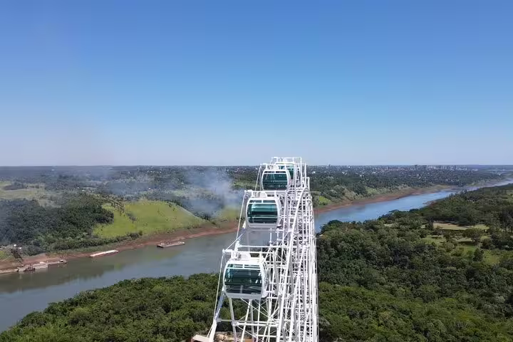Aerial view of the Yup Star Ferris Wheel overlooking lush landscapes and river, highlighting a must-see private tour attraction.