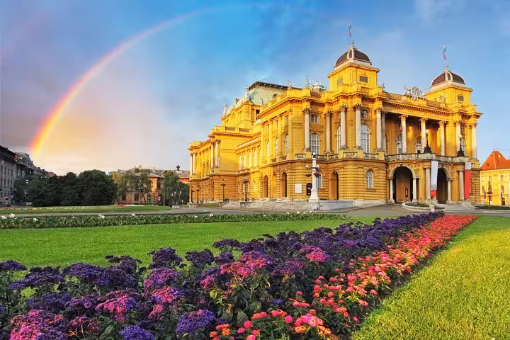 Zagreb Croatian National Theatre with rainbow and flowerbeds, cultural stop on Discover Croatia 11-day tour