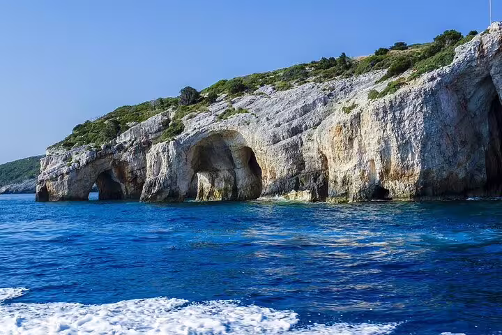 Sea caves and limestone cliffs on southern Zakynthos half-day tour, scenic coastline view from the boat