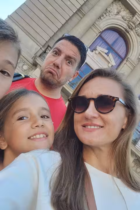 Family taking a selfie during a self-guided walking tour in Porto Old Town