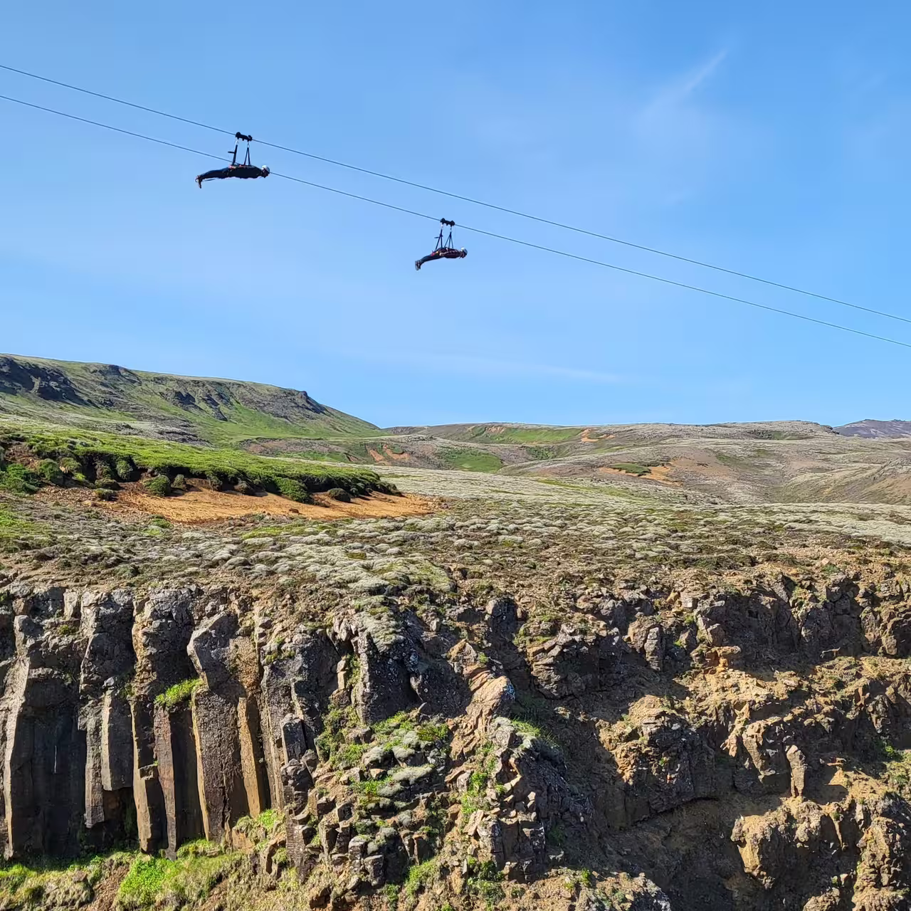 Zipline adventure over stunning rocky canyon with lush landscape on the "Double Thrill: Wings of the Bird, Flight of the Falcon" tour.