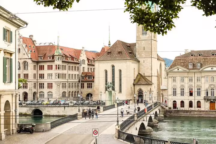Historic Zurich old town with Münsterbrücke bridge over Limmat River and Grossmünster church