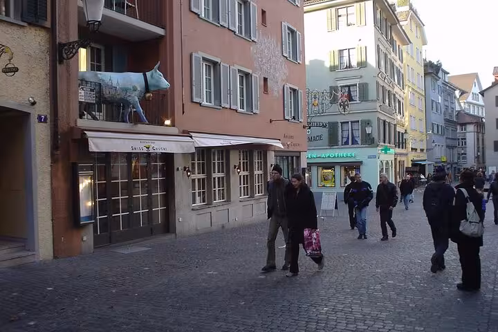 Busy pedestrian street in Zurich's old town, featuring quaint shops and vibrant architecture, a must-visit on the tour.