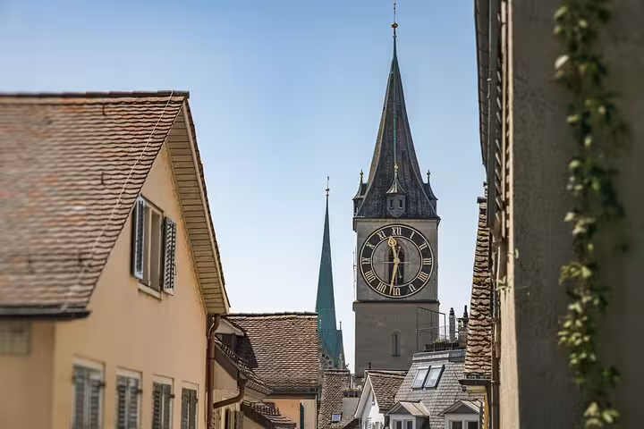 Zurich St. Peter Church clock tower above Old Town rooftops, highlight on Zurich 360 City Walk Tour route