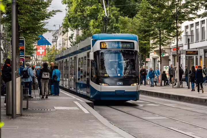 Modern tram in Zurich city center, showcasing urban charm for travelers on private tours with cruise and chocolate highlights.
